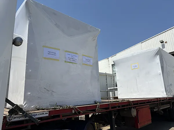 A substation kiosk wrapped in plastic on the back of a truck in Queensland, Australia